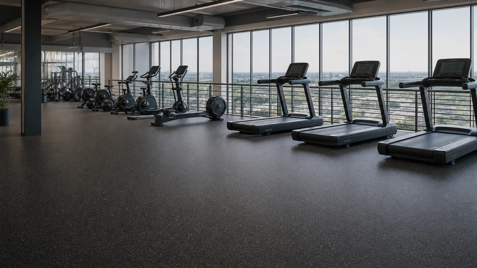 Upper-level cardio area with low-seam rubber flooring
