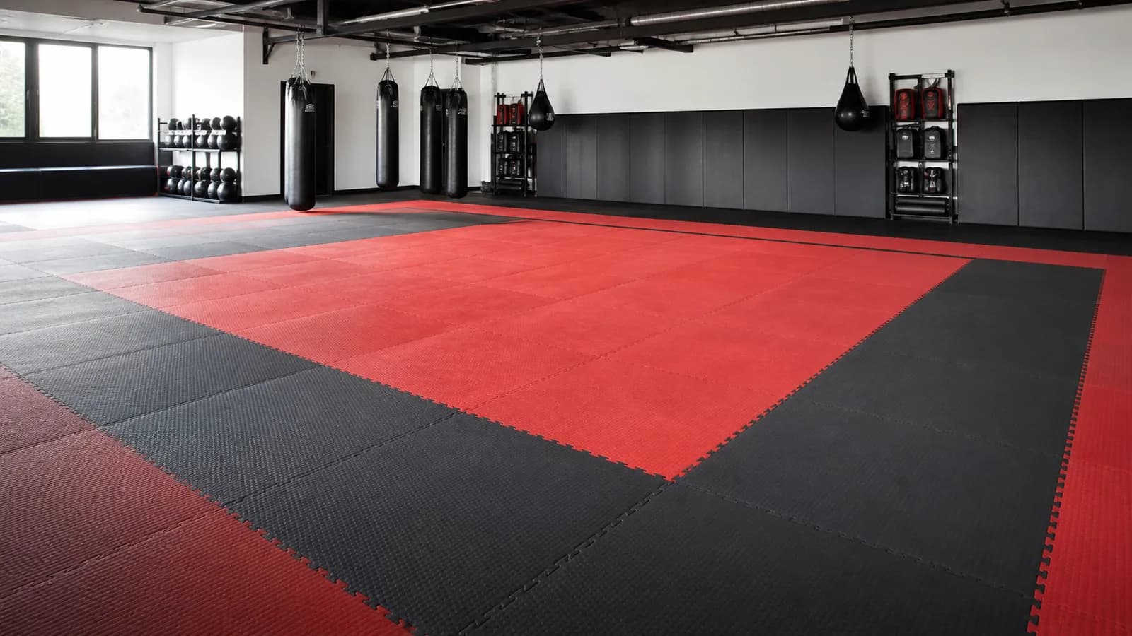 Professional martial arts dojo with red and charcoal tatami mats