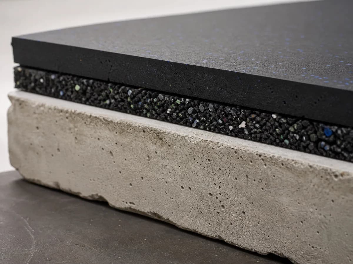 Acoustic underlay beneath rubber finish flooring