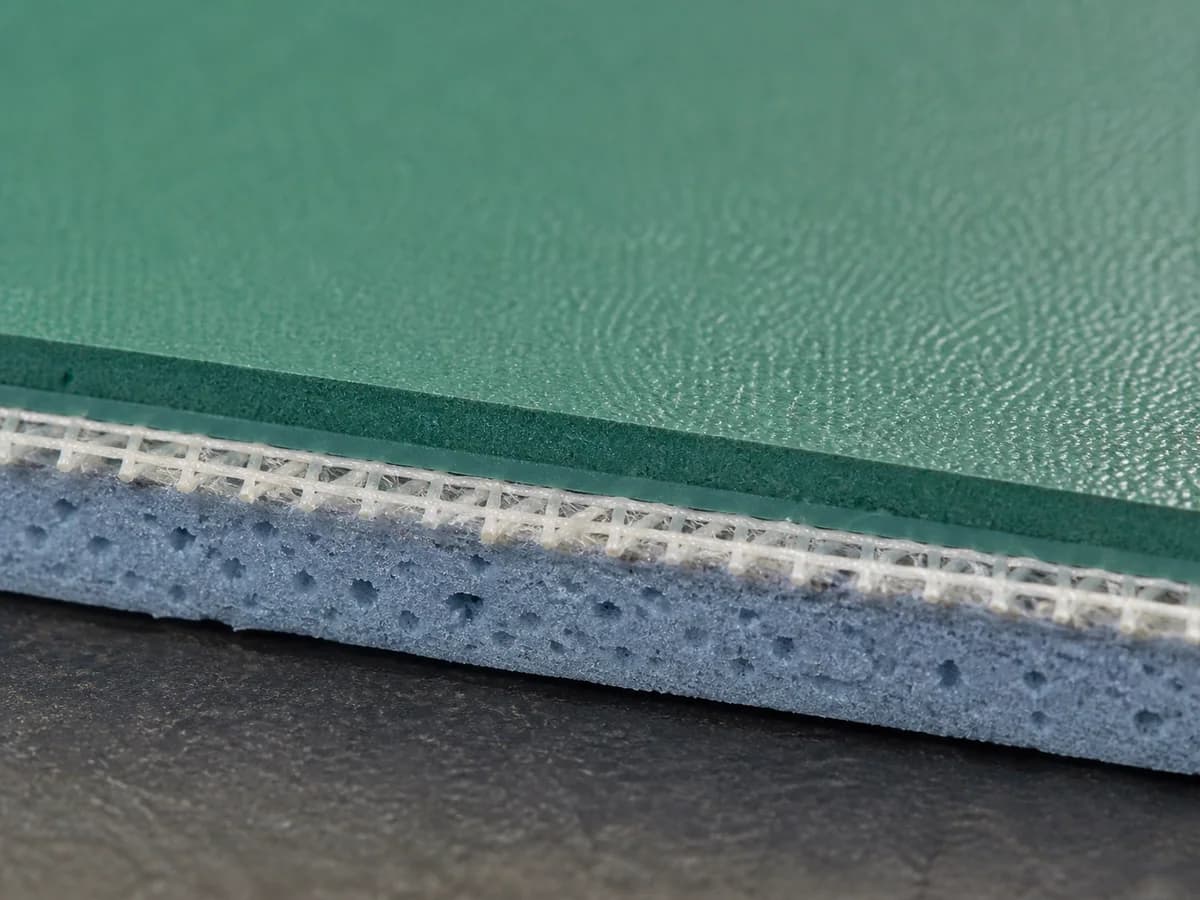 Layered resilient PVC flooring construction