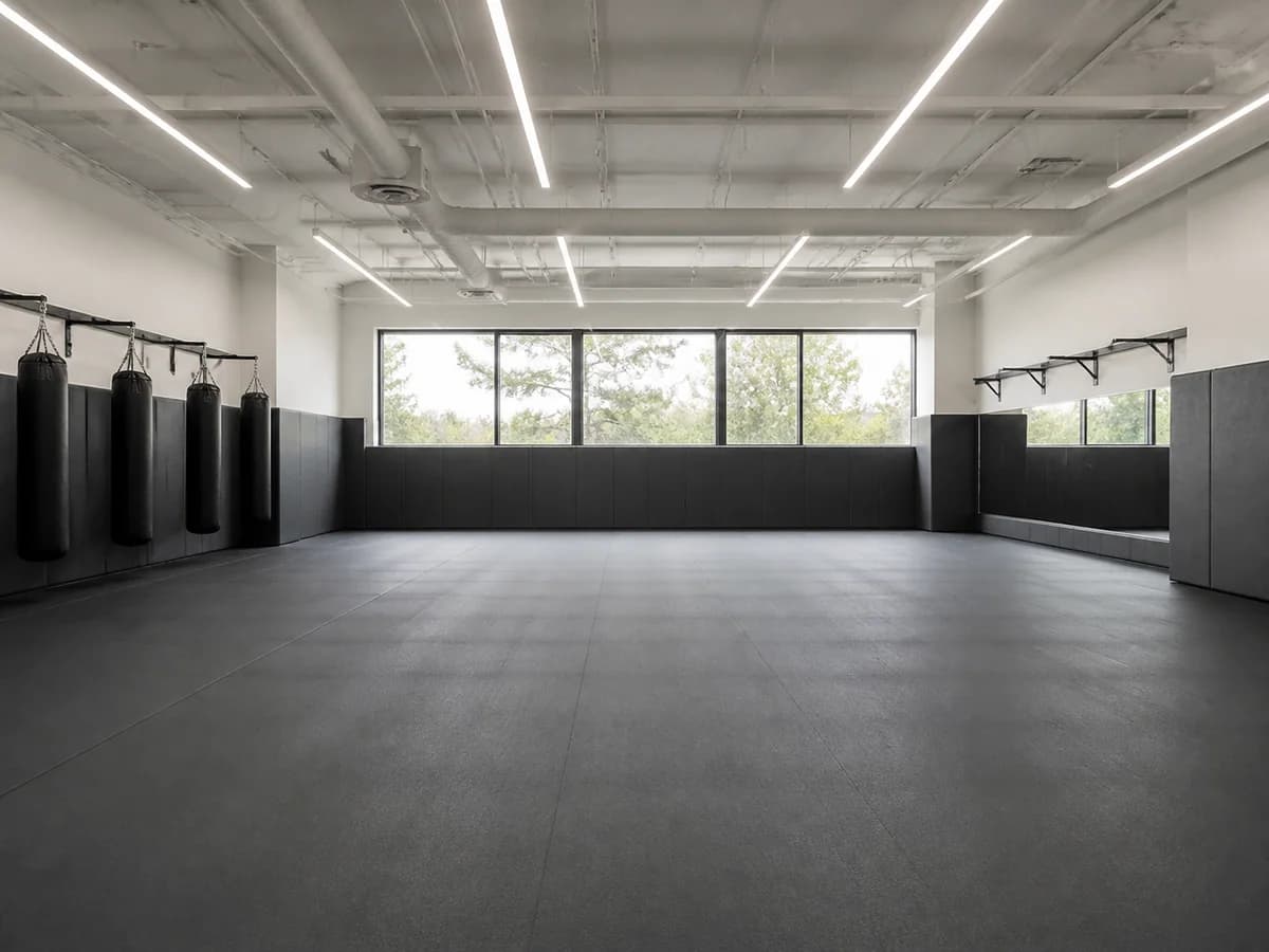 Continuous roll mat surface used in a multipurpose athletic training room