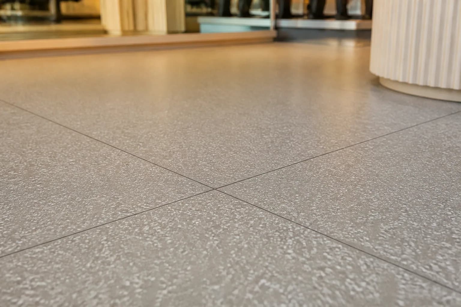 Group fitness and personal training studio: material texture, scale and seam detail using patterned commercial rubber tiles with resilient support-area options
