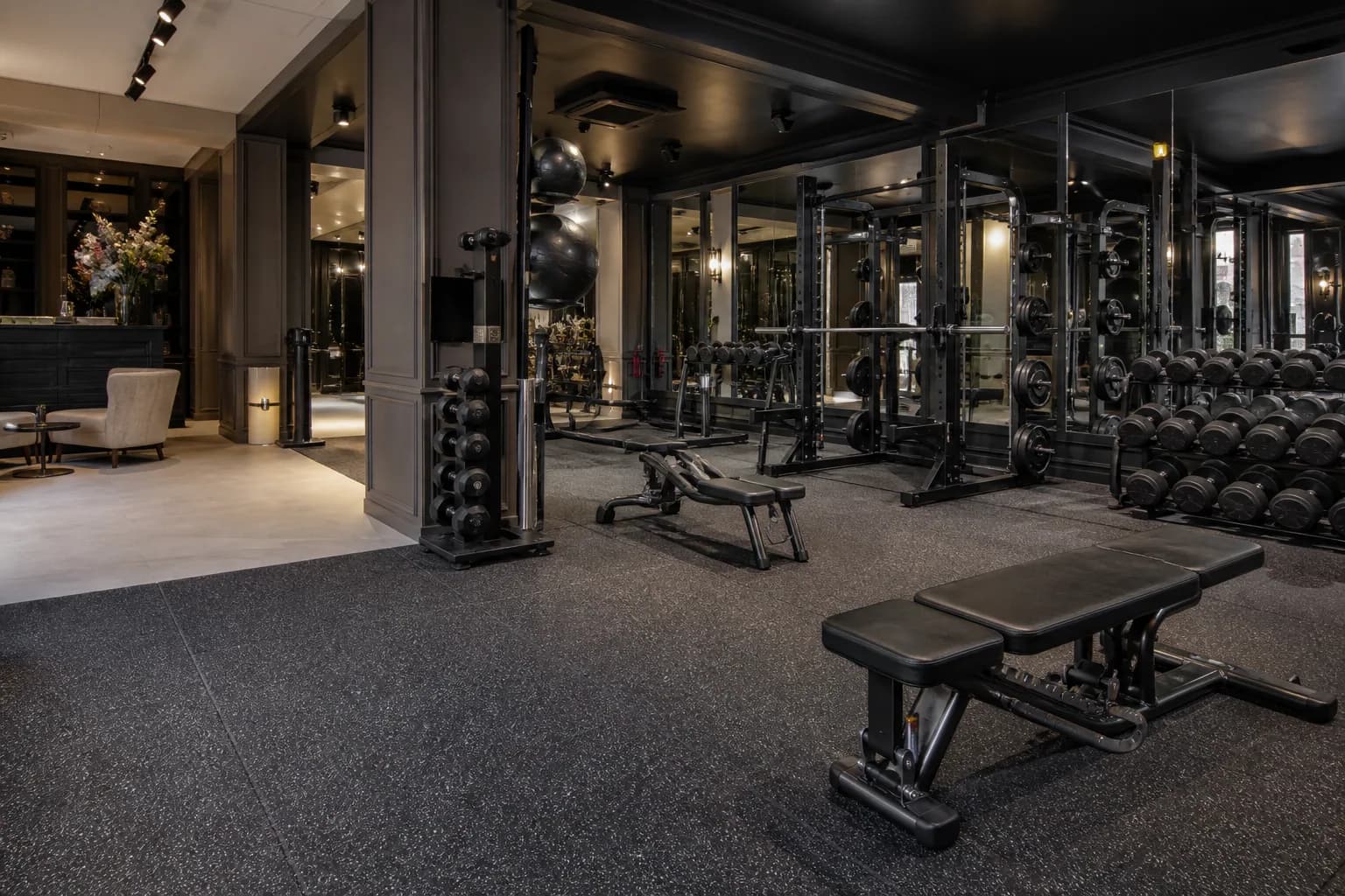 Group fitness and personal training studio: primary training zone and equipment interface using patterned commercial rubber tiles with resilient support-area options