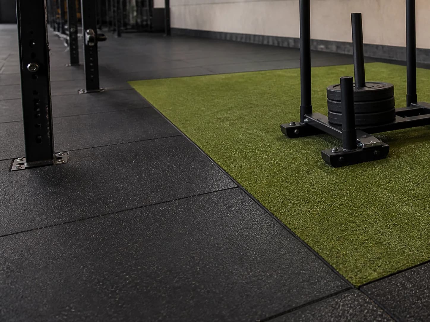 Flush junction between gym turf and rubber training tiles