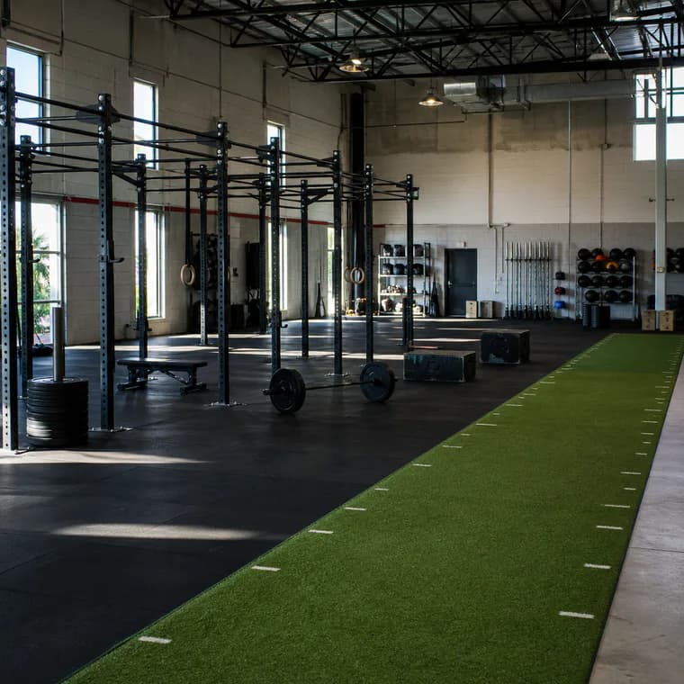 Functional fitness area with rubber floor and turf strip