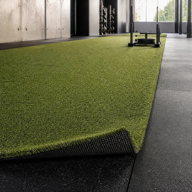 Indoor gym turf lane with realistic rubber backing