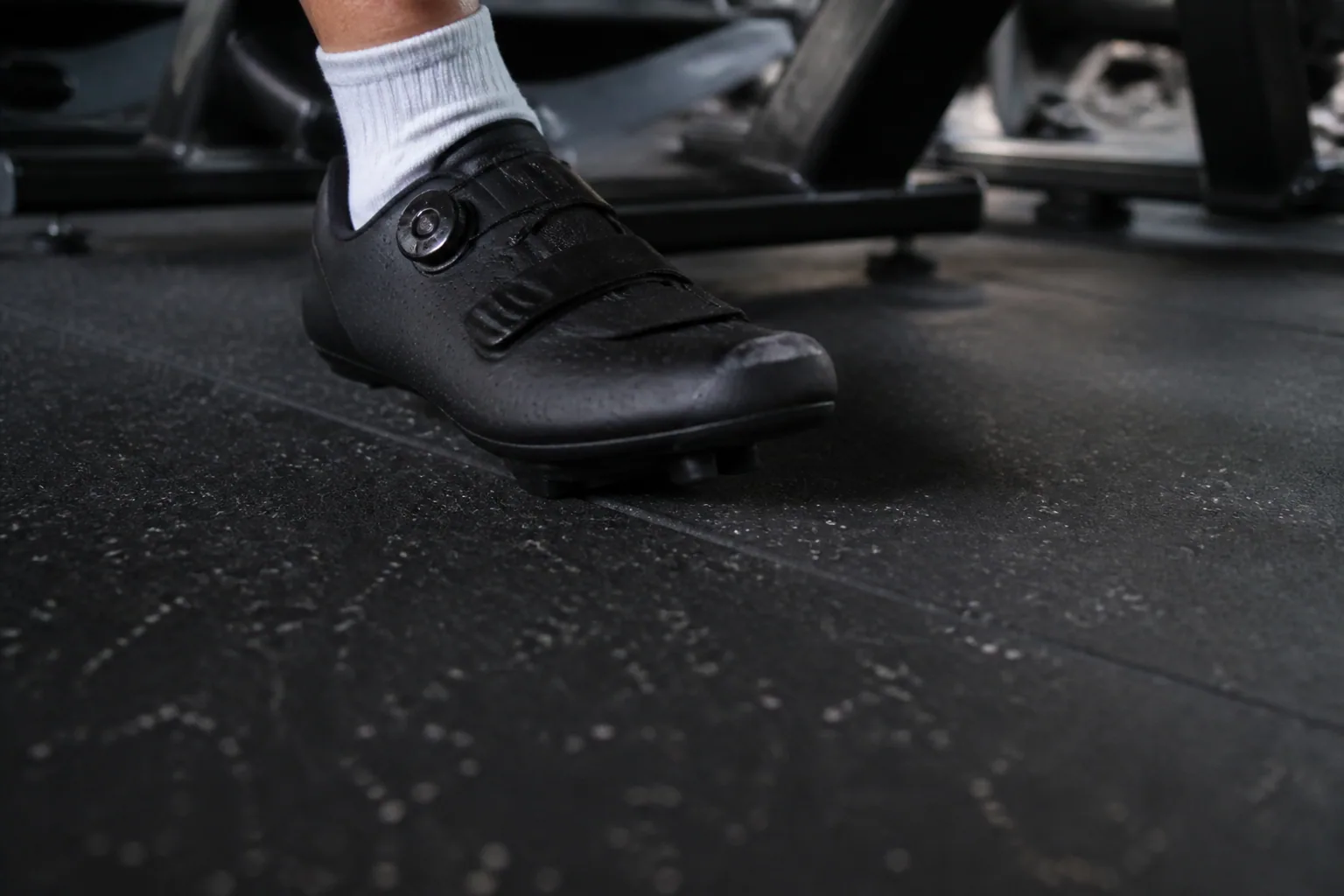Indoor cycling studio: material texture, scale and seam detail using dense bonded rubber roll with platform and threshold details