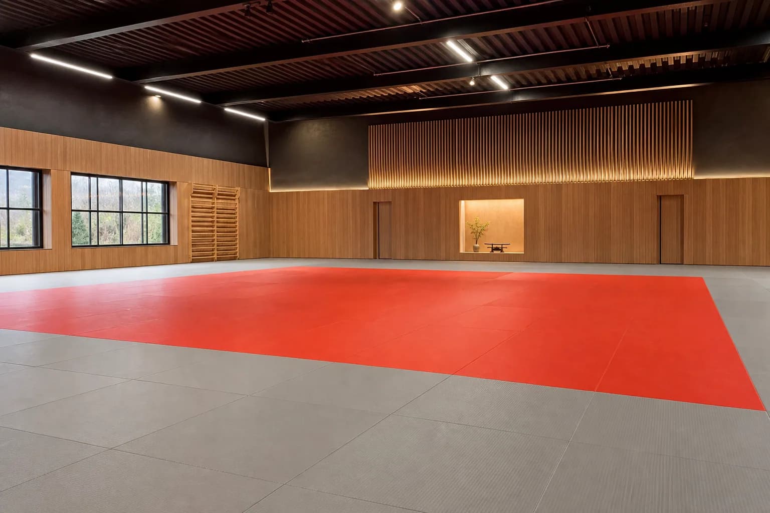 Judo and multi-discipline martial arts academy: completed facility and full flooring concept using textured interlocking tatami mat field with controlled perimeter restraint