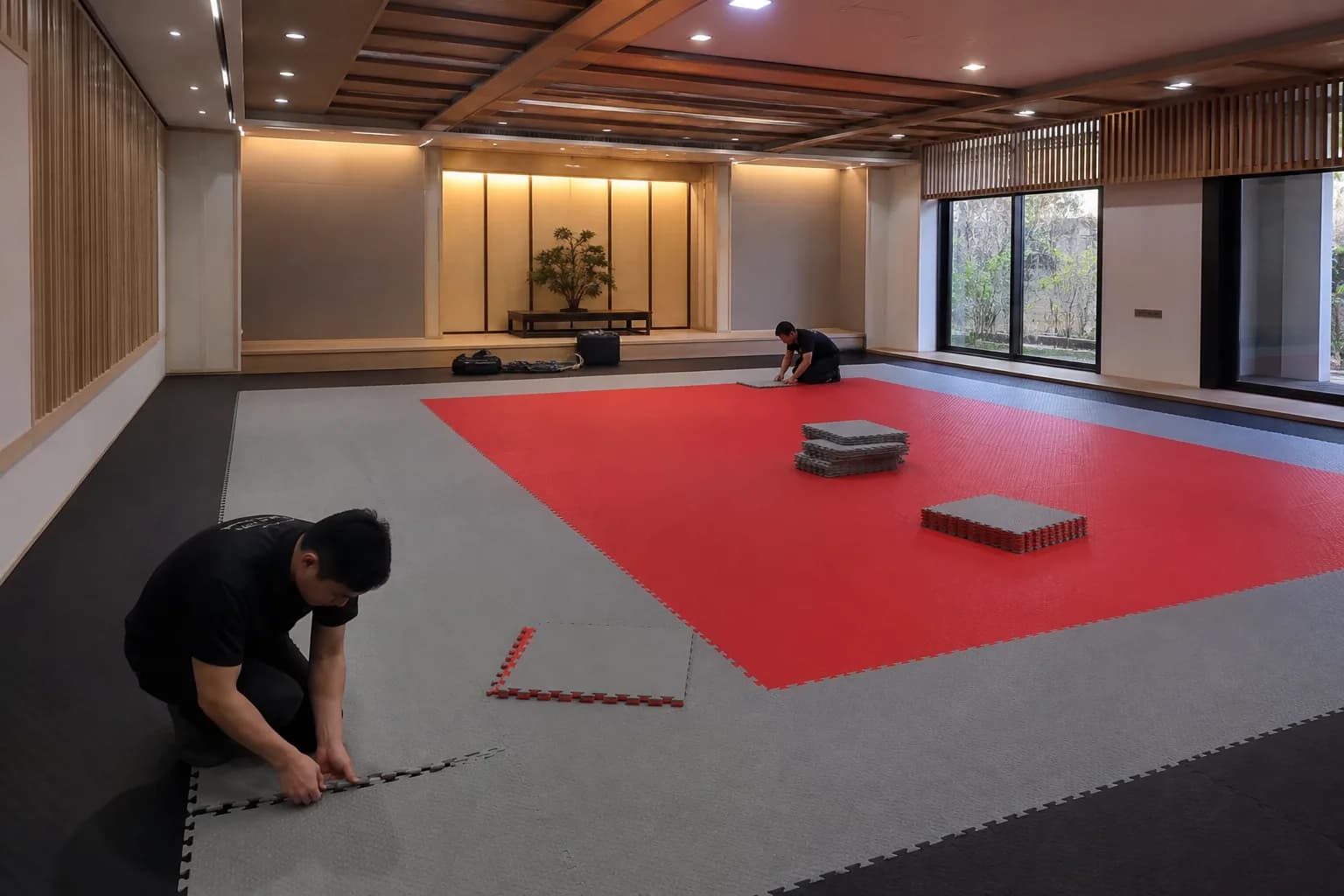 Judo and multi-discipline martial arts academy: subfloor, set-out and installation control using textured interlocking tatami mat field with controlled perimeter restraint