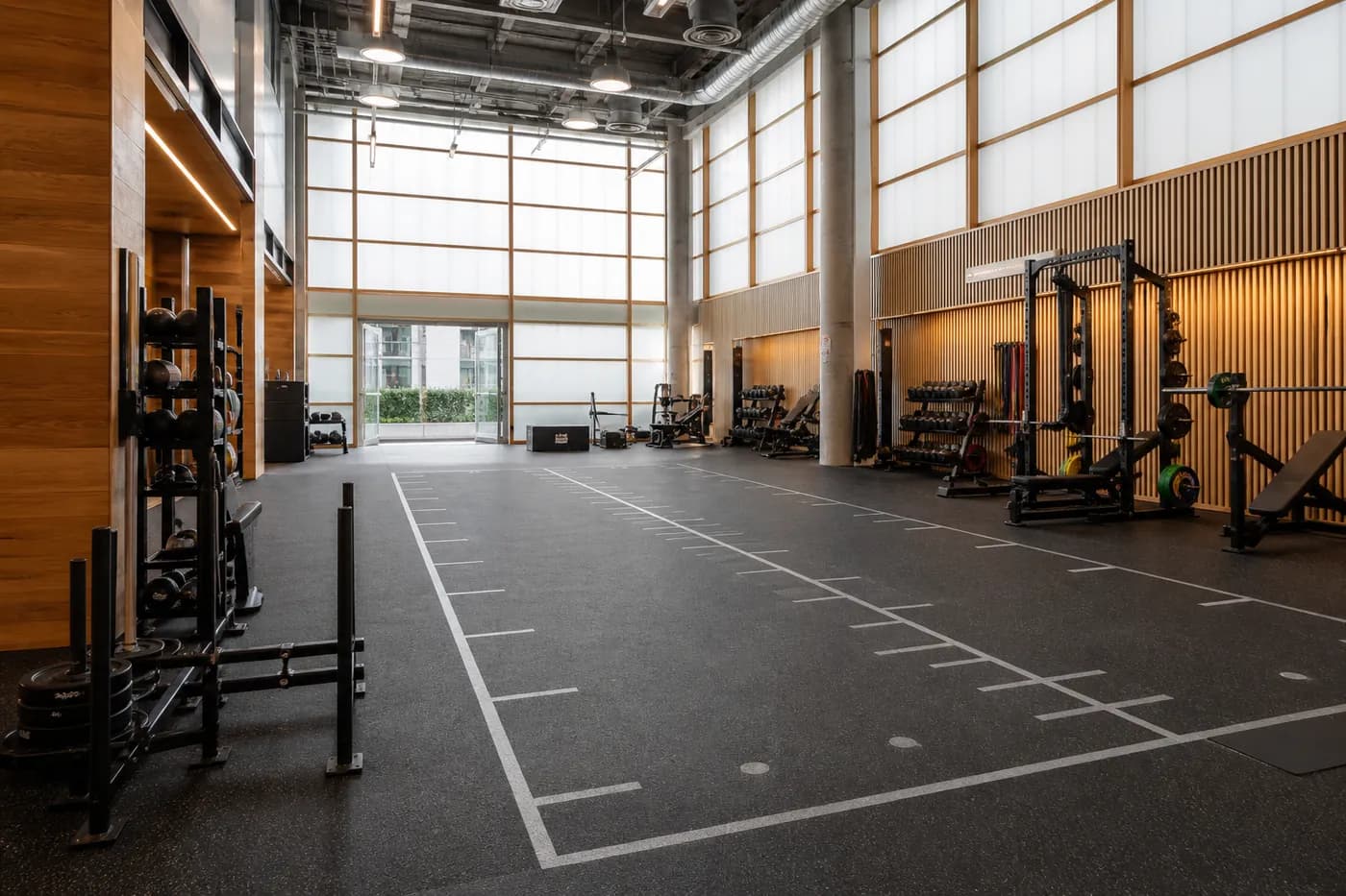 Sports performance facility with rubber training floor and marked functional movement zone