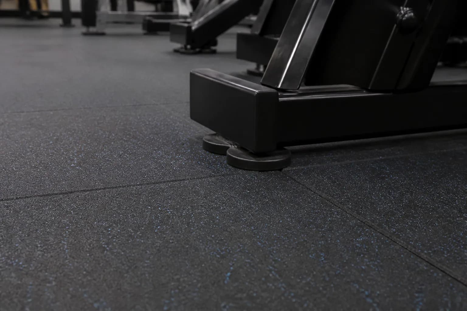 Secondary-school fitness and physical education room: material texture, scale and seam detail using durable rubber tile and roll system with supervised activity zones
