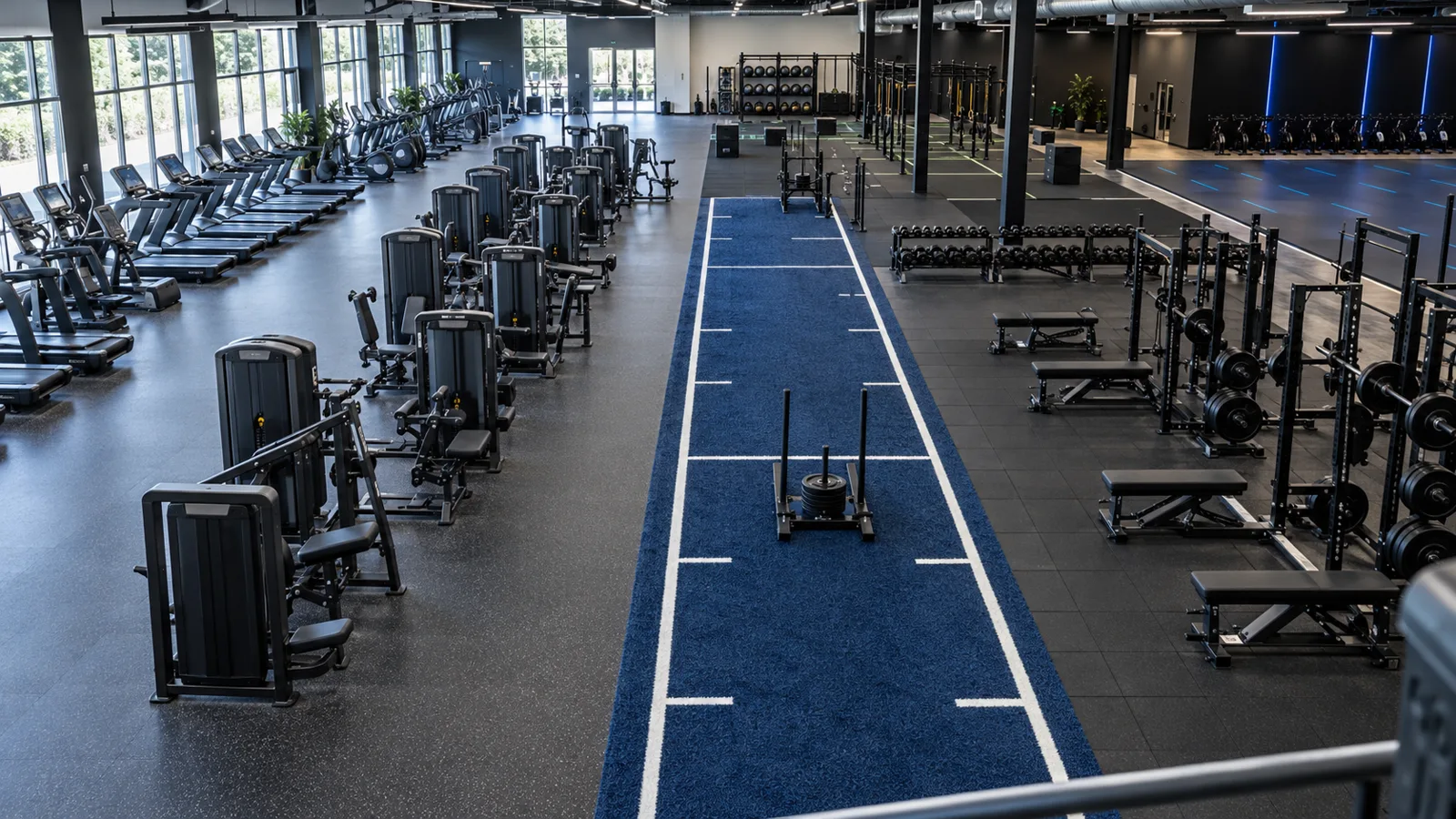 Commercial gym flooring zones with rubber tiles, rolls and training turf